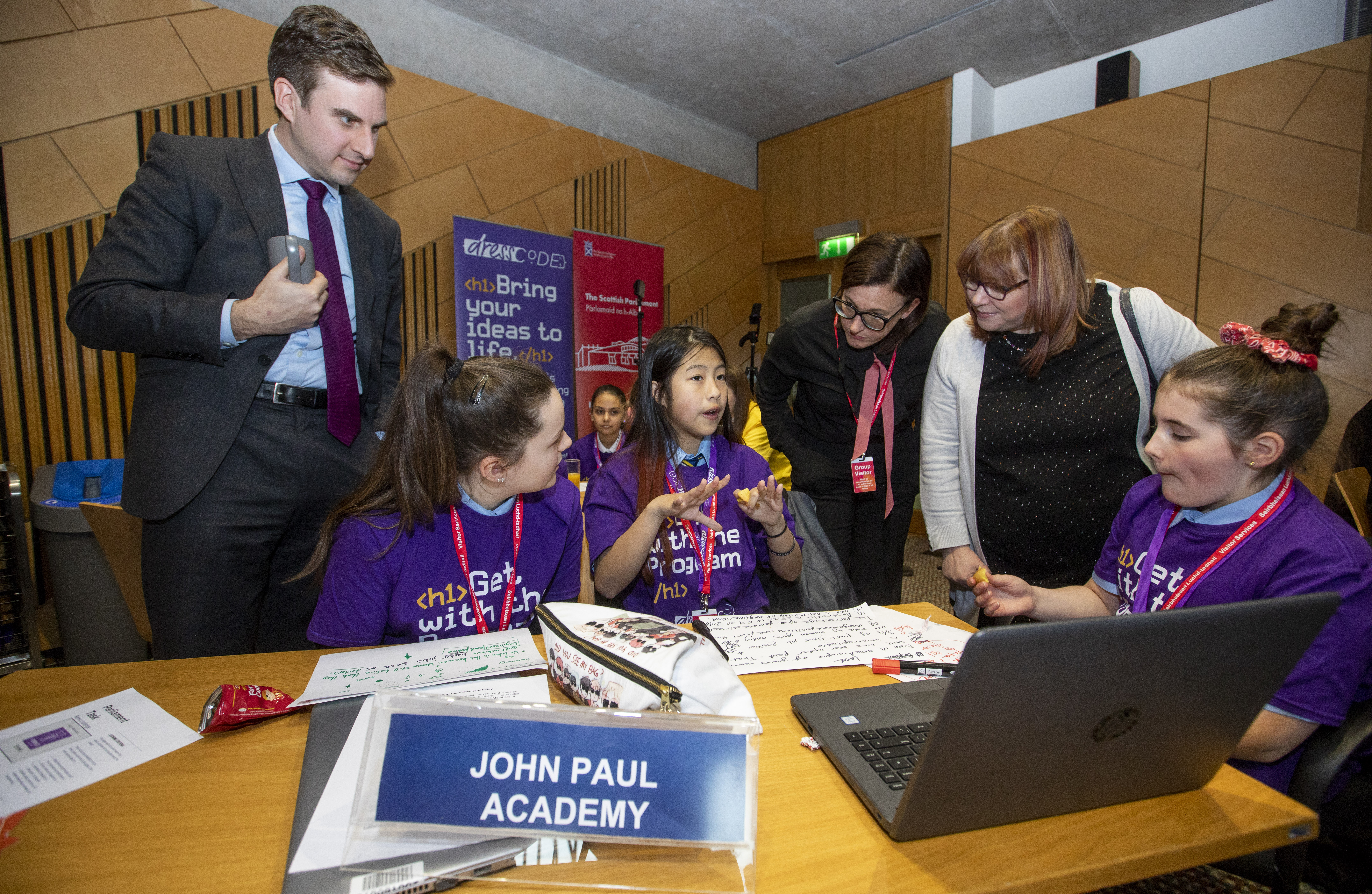 Image shows two Committee Members chatting with three secondary school pupils participating in Hackathon event, to mark the launch of the Committee's report into Science, Technology, Engineering and Maths learning.